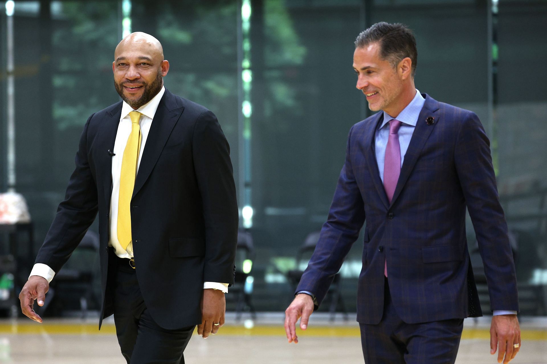 LA Lakers Head Coach Darvin Ham enters with Vice President of Basketball Operations Rob Pelinka before the introductory press conference at UCLA Health Training Center on June 06, 2022 in El Segundo, California.